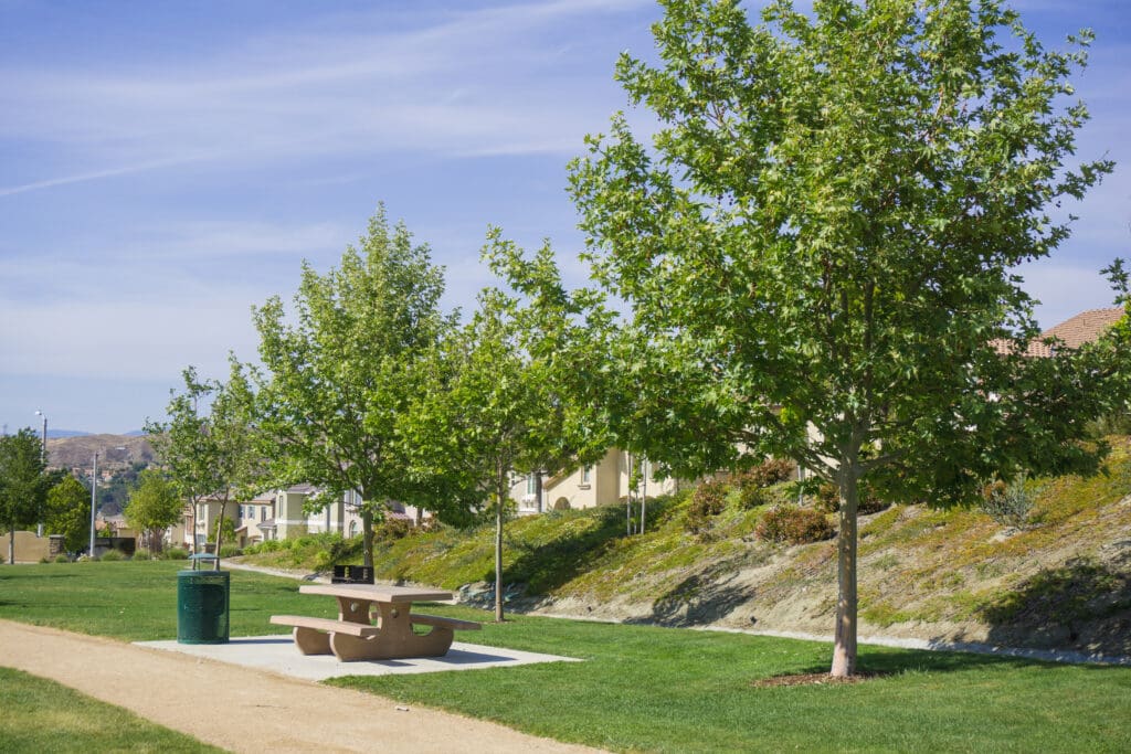 Enforcement of AB 1572 will be led by the State Water Resources Control Board, which will develop regulations, conduct audits, and oversee compliance to ensure HOAs and other property managers eliminate potable water use on nonfunctional turf by the 2027 deadline.